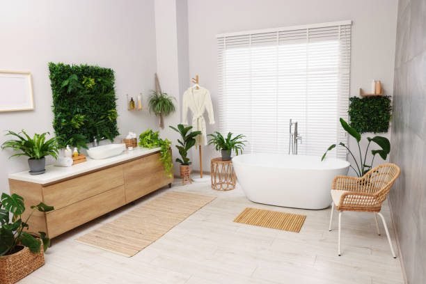 Small bathroom with bathtub shower combo and indoor greenery.