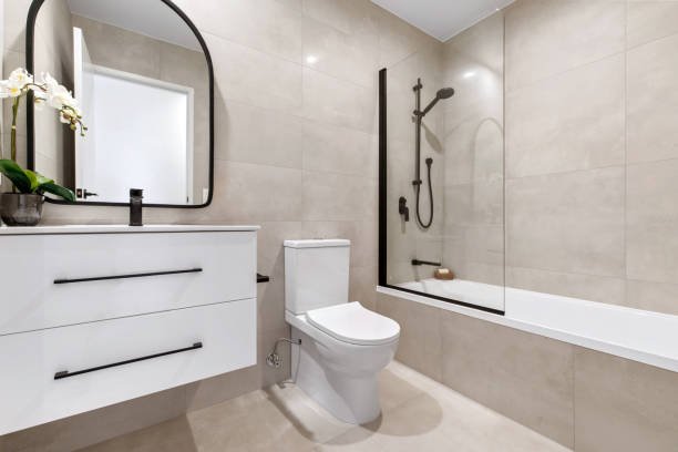 Small bathroom with a wall-mounted toilet that saves floor space.