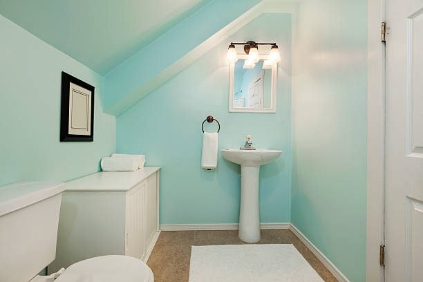 Small bathroom with a compact sink for saving space.