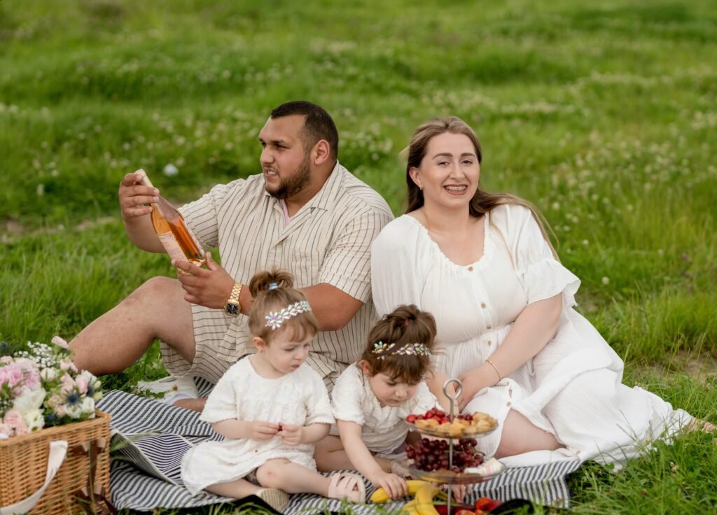 Parents and children enjoying a family activity together, following whatutalkingboutfamily tips to enhance communication, respect, and emotional awareness.