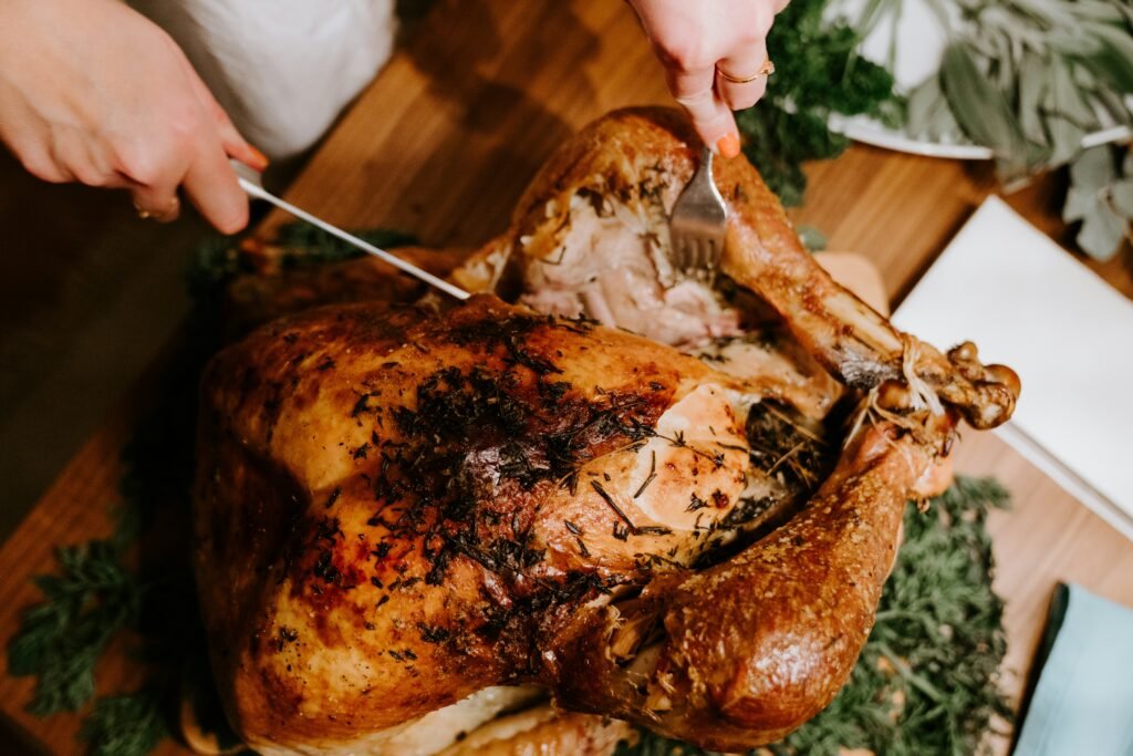 Cooking Turkey Breast sliced and served with seasoning for a flavorful dinner.