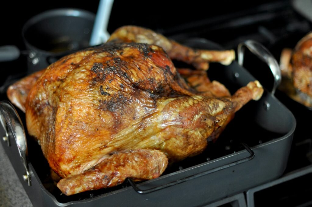 Cooking Turkey Breast in a kitchen setting with a golden crust and fresh ingredients.
