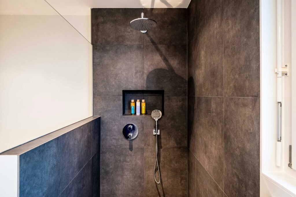 How to Fix Leaking Shower Head covering dripping shower repairs, seal replacement, mineral buildup removal, plumbing maintenance, and water efficiency.